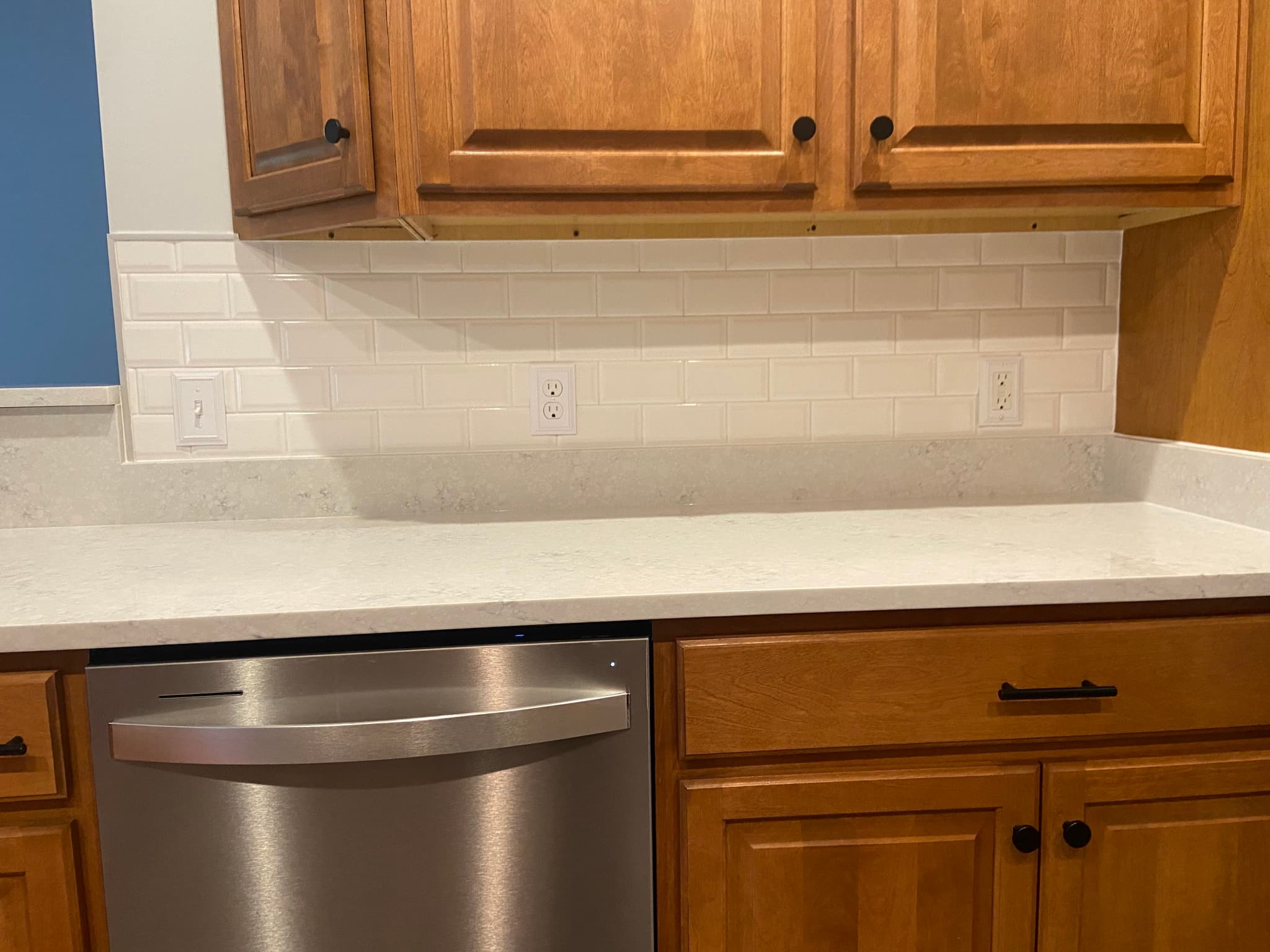 Kitchen with subway tile backsplash and stainless steel dishwasher